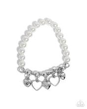 Load image into Gallery viewer, Paparazzi “Charming Canidate” White Stretch Bracelet
