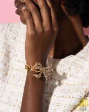 Load image into Gallery viewer, Paparazzi “Its All A-BOW-t Me” Gold Stretch Bracelet
