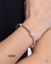 Load image into Gallery viewer, Paparazzi “Ladylike Leader” White Coil Cuff Bracelet - Paparazzi Accessories
